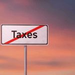 Tax Cut Tsunami—Congress Stuns America Sign with the word Taxes crossed out.