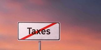 Tax Cut Tsunami—Congress Stuns America Sign with the word Taxes crossed out.