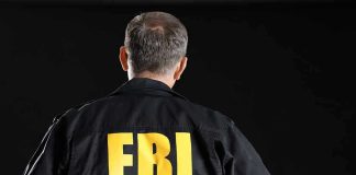 FBI Raids NBA Gambling Den—Nobody Safe FBI agent with back facing the camera