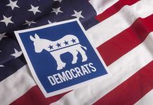 Democrat BETRAYS Party — Socialism Warning STUNS Democratic Party symbol on American flag background