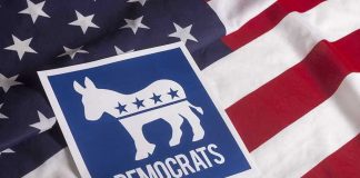 Democrat BETRAYS Party — Socialism Warning STUNS Democratic Party symbol on American flag background