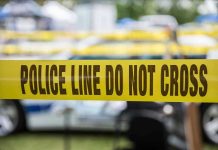 $1M Bond for Terror Threat Suspect Yellow police line tape with Do Not Cross.