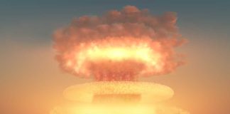 Nuclear Threat: Putin Aggressively Responds to Trump A nuclear explosion creating a large mushroom cloud against a sunset sky