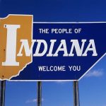 Lt. Gov. Accused in Shocking AI Adult Video Welcome sign for the state of Indiana against a blue sky