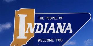 Lt. Gov. Accused in Shocking AI Adult Video Welcome sign for the state of Indiana against a blue sky