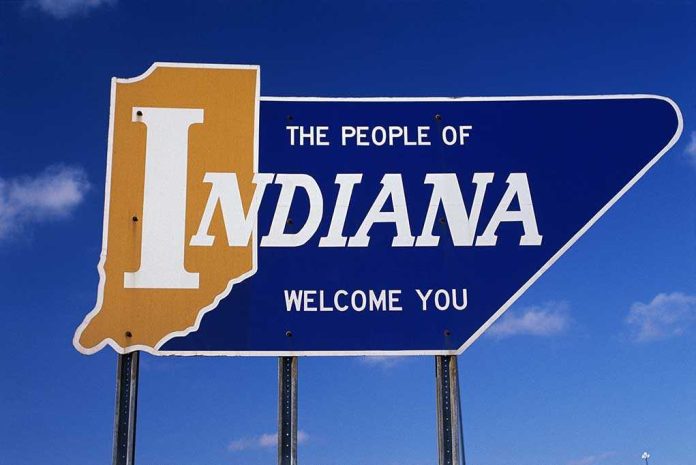 shutterstock_135614681.jpg Welcome sign for the state of Indiana against a blue sky