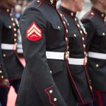 Marine Vet’s Exit Seat Removal: Shocking Airline Policy Clash Marines in formal uniforms marching in a parade