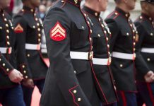 Marines in formal uniforms marching in a parade