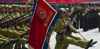 North Korea BRAGS About Bloodshed in Europe Soldiers marching with rifles and a red flag