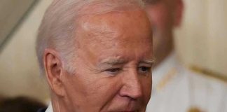 Man in a suit looking thoughtful.