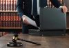 Pokémon GO Murder: Shocking Twist in Cold Case Gavel, lawyer, briefcase, and legal books on the table.
