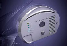 Drunk Raccoon Triggers Security Panic! A carbon monoxide alarm with indicator lights and a sleek design