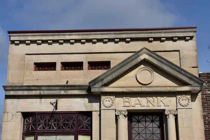 Stone building facade with bank sign and columns