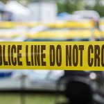 After 20 Years A Murder Case Finally Broke Open Yellow police line tape with Do Not Cross.