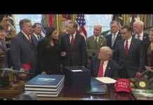 Trump signs spending bill ending four-day government