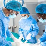 Surgeons performing an operation in a sterile environment.