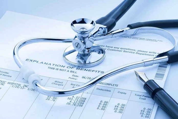 A stethoscope resting on a medical billing statement