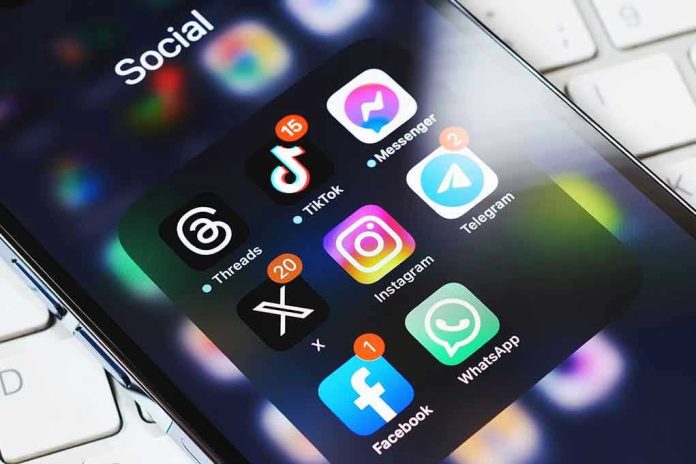 2339442245 Smartphone showing social media app icons in a folder.