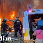 Belfast residents run from burning homes as violence erupts after protests