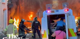 Belfast residents run from burning homes as violence erupts after protests