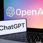 OpenAI ChatGPT logos on laptop and smartphone screens.