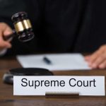 Forced Conversion Claims, Judge Walks Away Judge with gavel and Supreme Court nameplate.