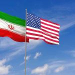 Leader Gone, Power Vacuum Looms Iran and United States flags waving on flagpoles