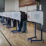 Election Debate Turns Into Fact-Check Moment Voters at polling booths in a gymnasium