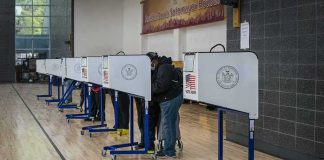 Election Debate Turns Into Fact-Check Moment Voters at polling booths in a gymnasium