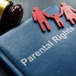 A legal document titled 'Parental Rights' with wooden figures representing a family and a gavel