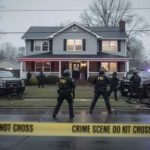 A Family Deliberately Targeted — Five Killed in East St. Louis Thursday FBI agents at a crime scene outside a house with police vehicles and caution tape