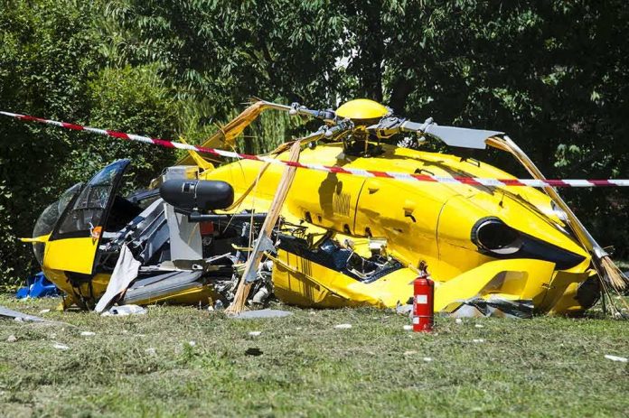 shutterstock_108419492 yellow helicopter crash scene on grassy field