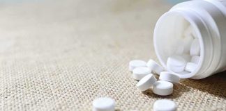 Pilot High, 70,000 Pills — Who Missed This? White tablets spilling from a plastic bottle