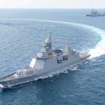 naval warship making a sharp turn at sea