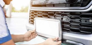 Police Snoop Tool Exposed — Is That Plate Yours? Person installing a car license plate on a front bumper