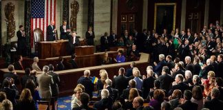 Family War Explodes On Capitol Hill Legislators give a standing ovation in a grand chamber