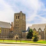 Gothic-style university building with central stone tower