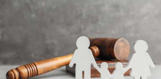 Australia’s Top Court Ends A Landmark Gender Case Family cutout figures with judge's gavel in background
