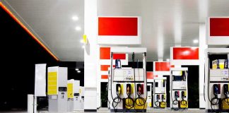 Gas station fuel pumps at night