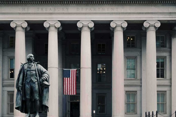 shutterstock_1240657660-1 Statue in front of a neoclassical government building with columns and a U.S. flag