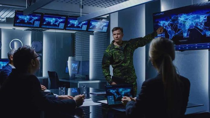 shutterstock_1243020970 military officer briefing team in command center