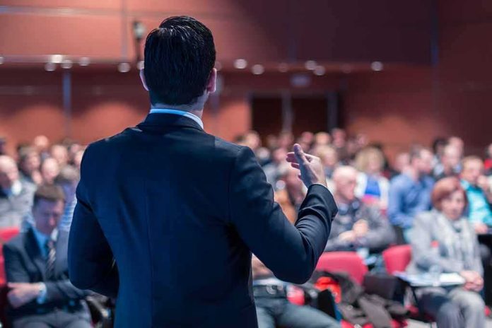 Speaker addressing an audience in a conference hall