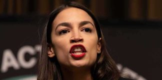 woman speaking passionately at a podium