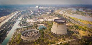 Abandoned cooling towers at a sprawling industrial site