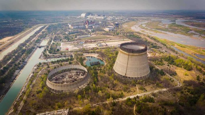 Abandoned cooling towers at a sprawling industrial site