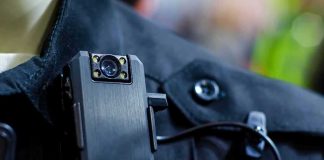 Body camera clipped to a dark uniform
