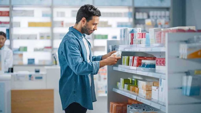 Man shopping in a pharmacy aisle