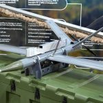 small military drone displayed on a green equipment case