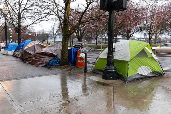 shutterstock_2137574817 Tents lined along a wet city sidewalk on a rainy day