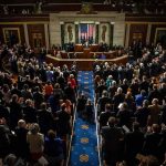 Medicare Fight Erupts — Leader Retreats Legislative chamber audience stands and applauds
